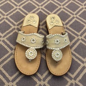 creme and white flip flops